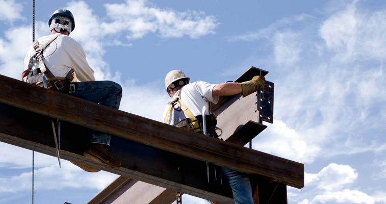 Workers on a steel surface