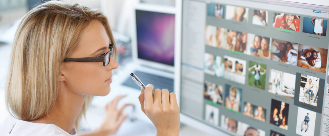 Woman looks at a media screen